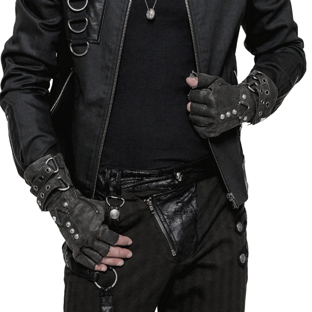 Man wearing edgy black leather jacket and steampunk-style leather gauntlet gloves with buckles and studs.