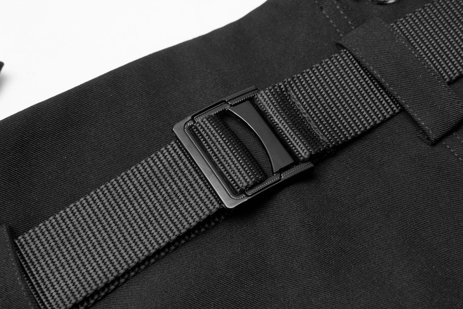 Close-up of a sleek black belt buckle on a durable strap, showcasing modern design and functionality.