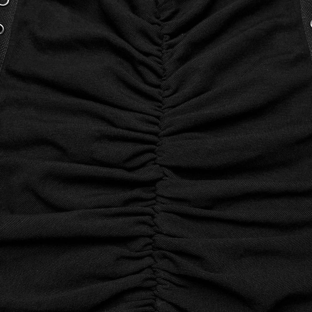 Close-up of the ruching detail on an edgy adjustable mini dress, showcasing the black elastic cotton fabric.