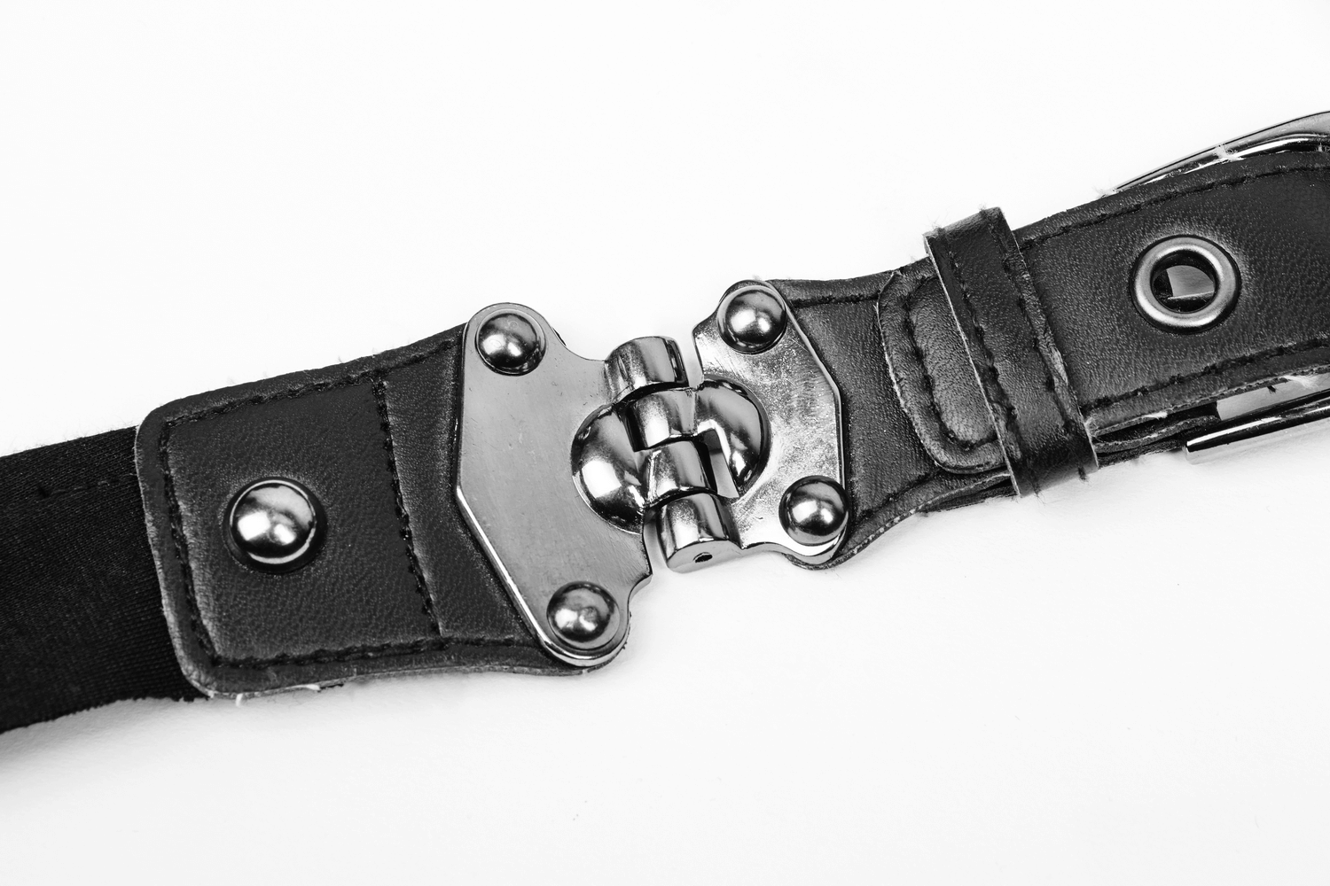 Close-up of a stylish black cape buckle with metal accents and textured leather, perfect for edgy fashion statements.