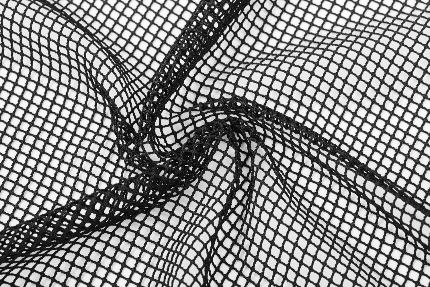 Close-up of black mesh fabric showcasing intricate netted texture for gothic fashion styles.