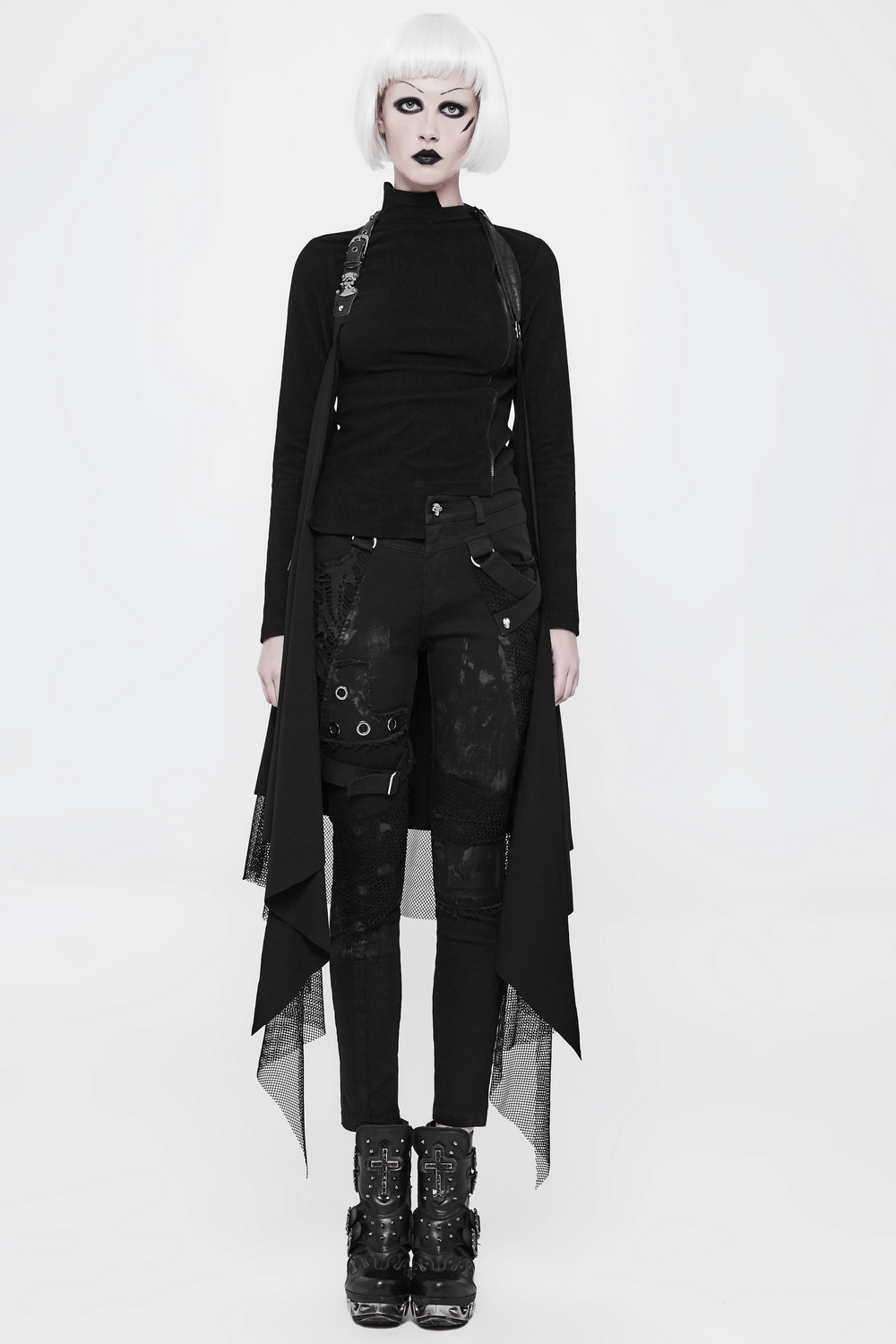 Edgy black asymmetrical lace-trim cape worn by a model with gothic style outfit and bold makeup.