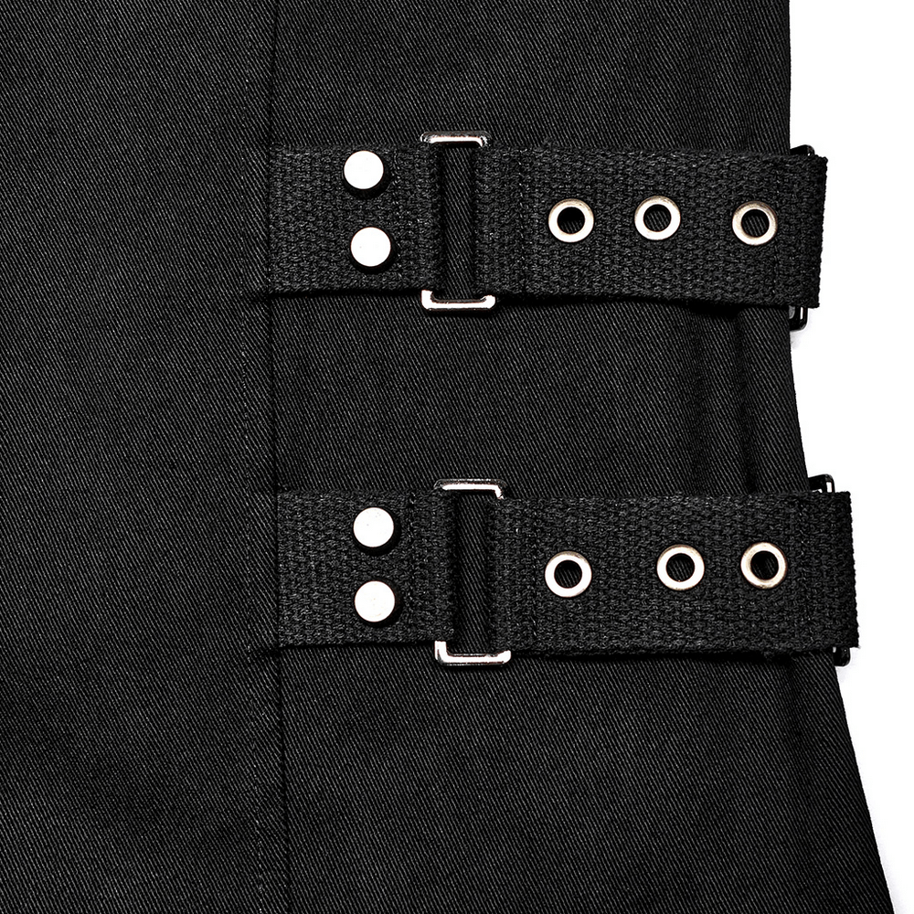 Close-up of black buckle straps on gothic vest, showcasing edgy punk style and unique design details.