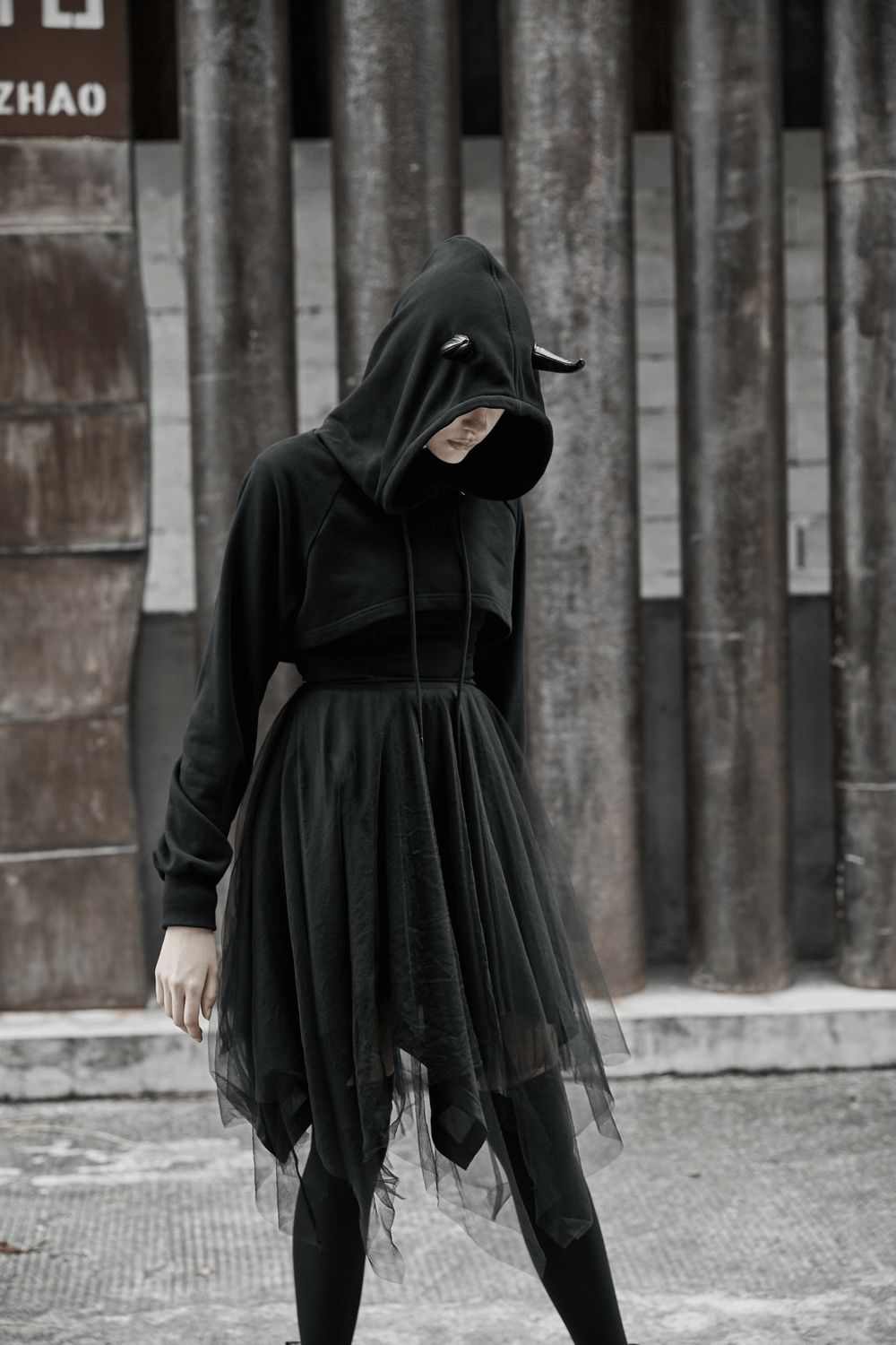 Edgy black crop hoodie with devil horns and tulle skirt for a stylish, standout look.
