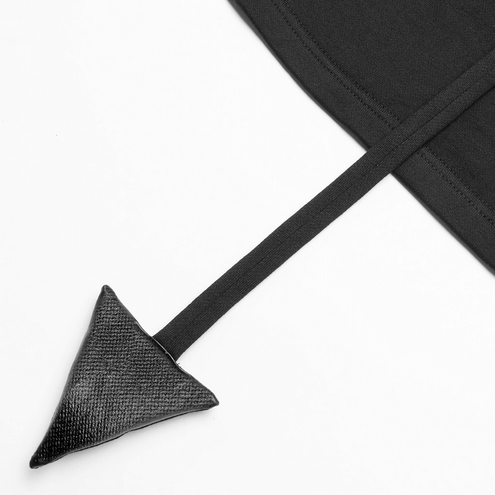 Close-up of the detachable tail of an edgy black crop hoodie with devil horns, perfect for a rockstar look.