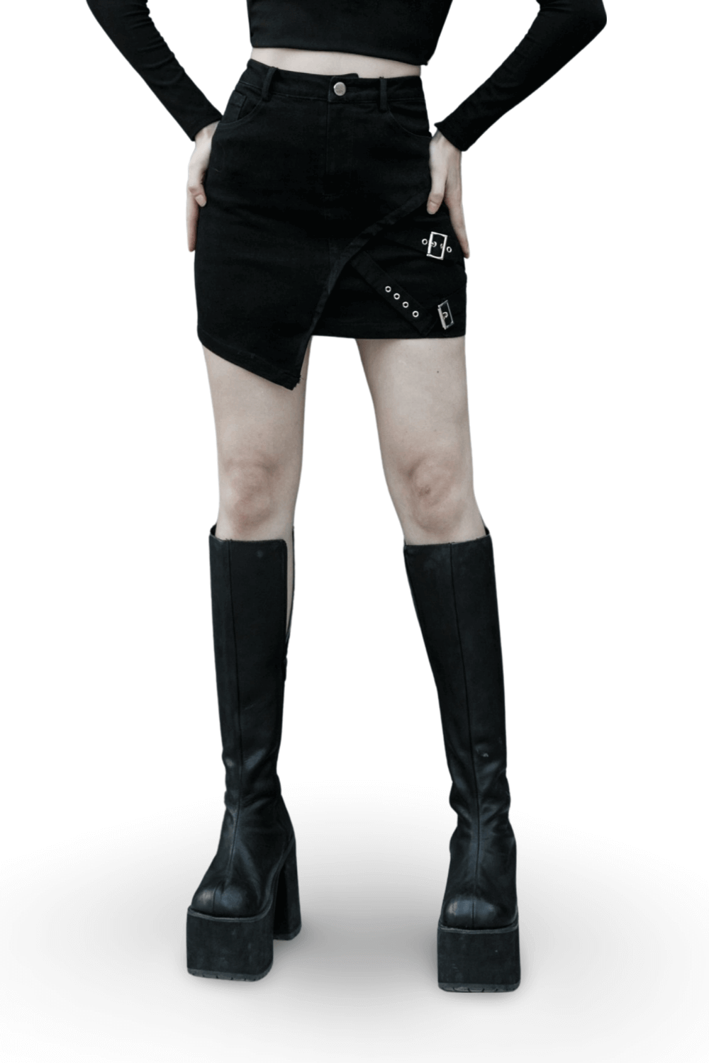 Edgy black denim mini skirt featuring buckle detail and asymmetrical design, paired with stylish knee-high platform boots.