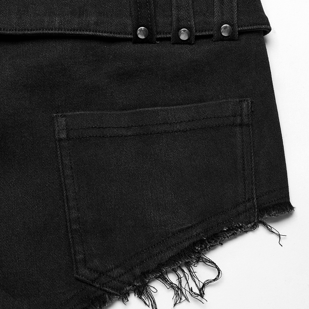 Close-up of edgy black denim shorts with frayed hem, adjustable metal buckle, and pocket detail.