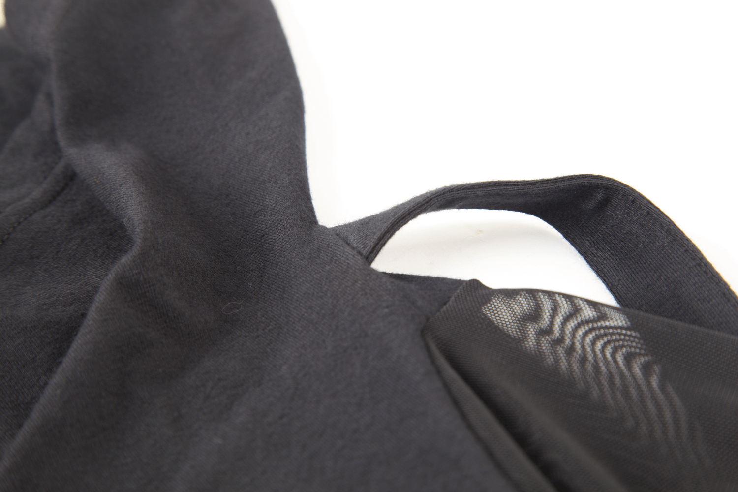 Close-up of edgy black hooded top showcasing mesh sleeve detailing for a stylish and contemporary look.