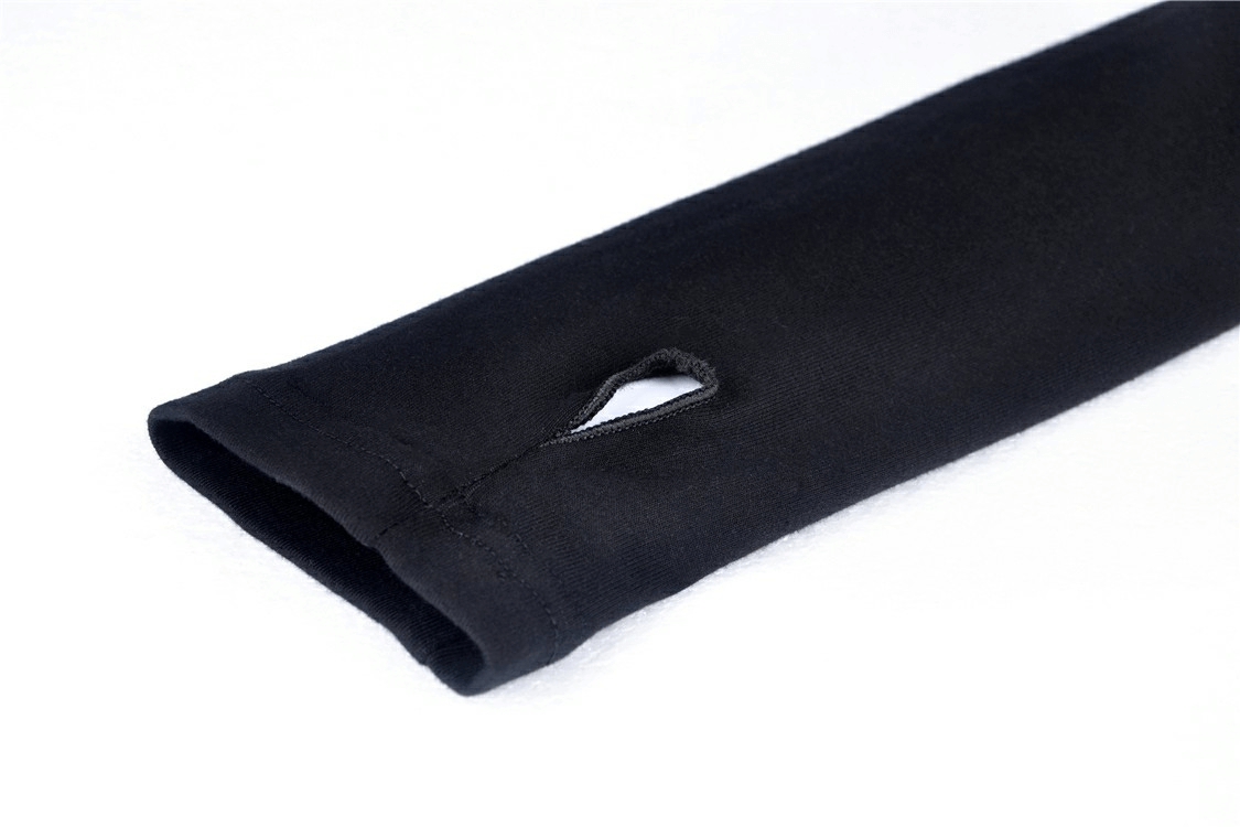 Close-up of the sleeve of an edgy black hoodie with a unique ripped detail adding punk-inspired style.
