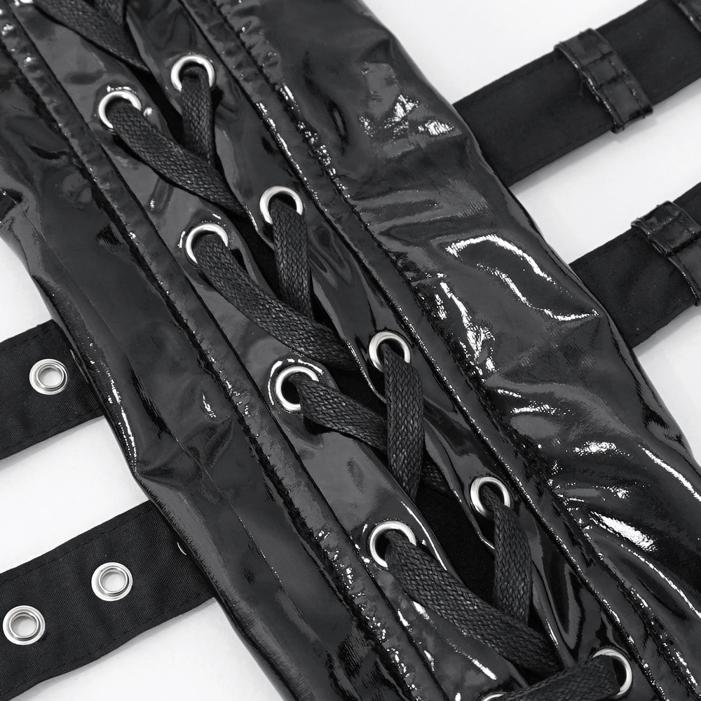 Close-up of black lace-up fingerless gloves featuring shiny material and intricate buckle details for edgy fashion.