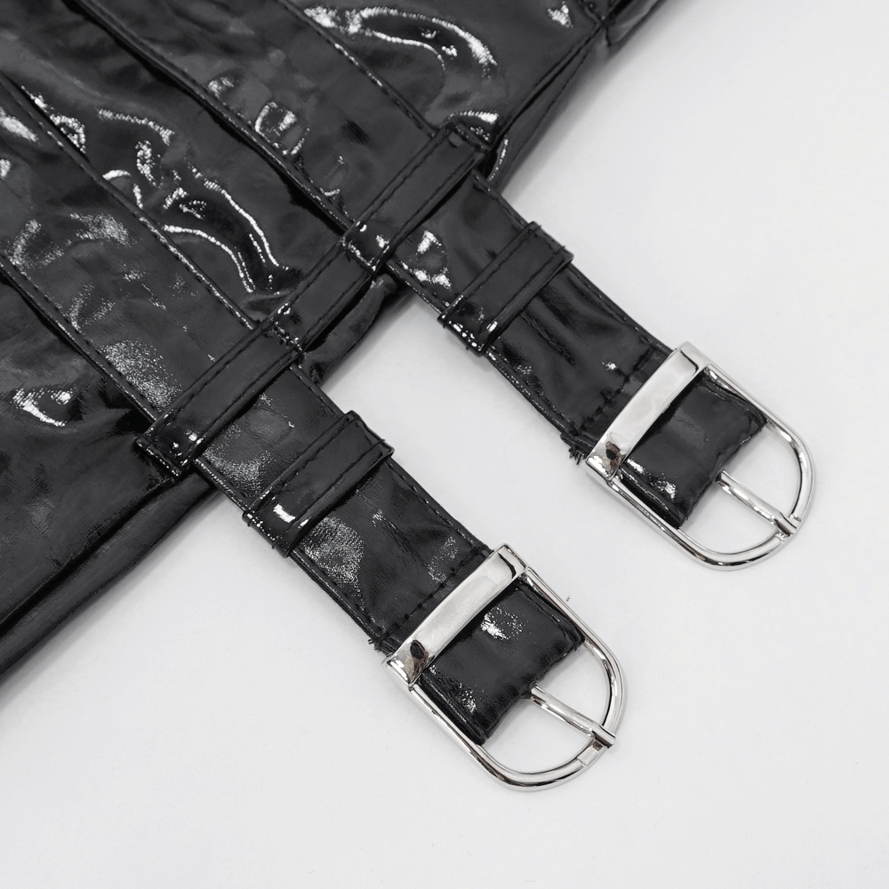 Close-up of shiny black lace-up gloves featuring stylish silver buckles for a gothic look.