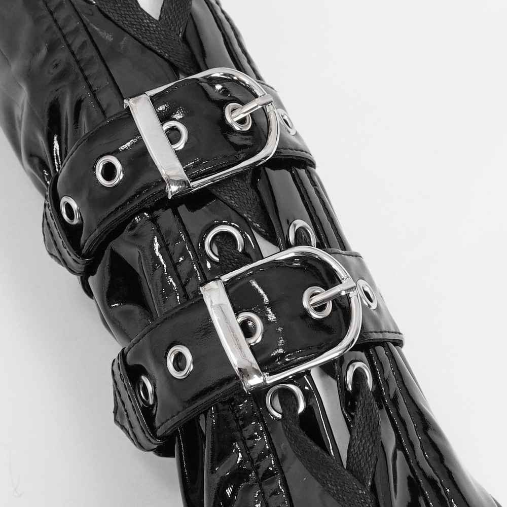 Close-up of edgy black lace-up fingerless gloves with shiny buckles and holes for a gothic flair.