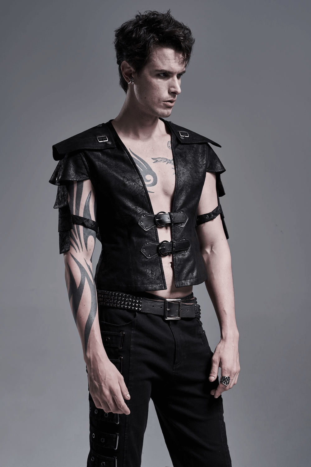 Edgy black leather vest with adjustable straps and unique shoulder cut-outs, perfect for a stylish statement.