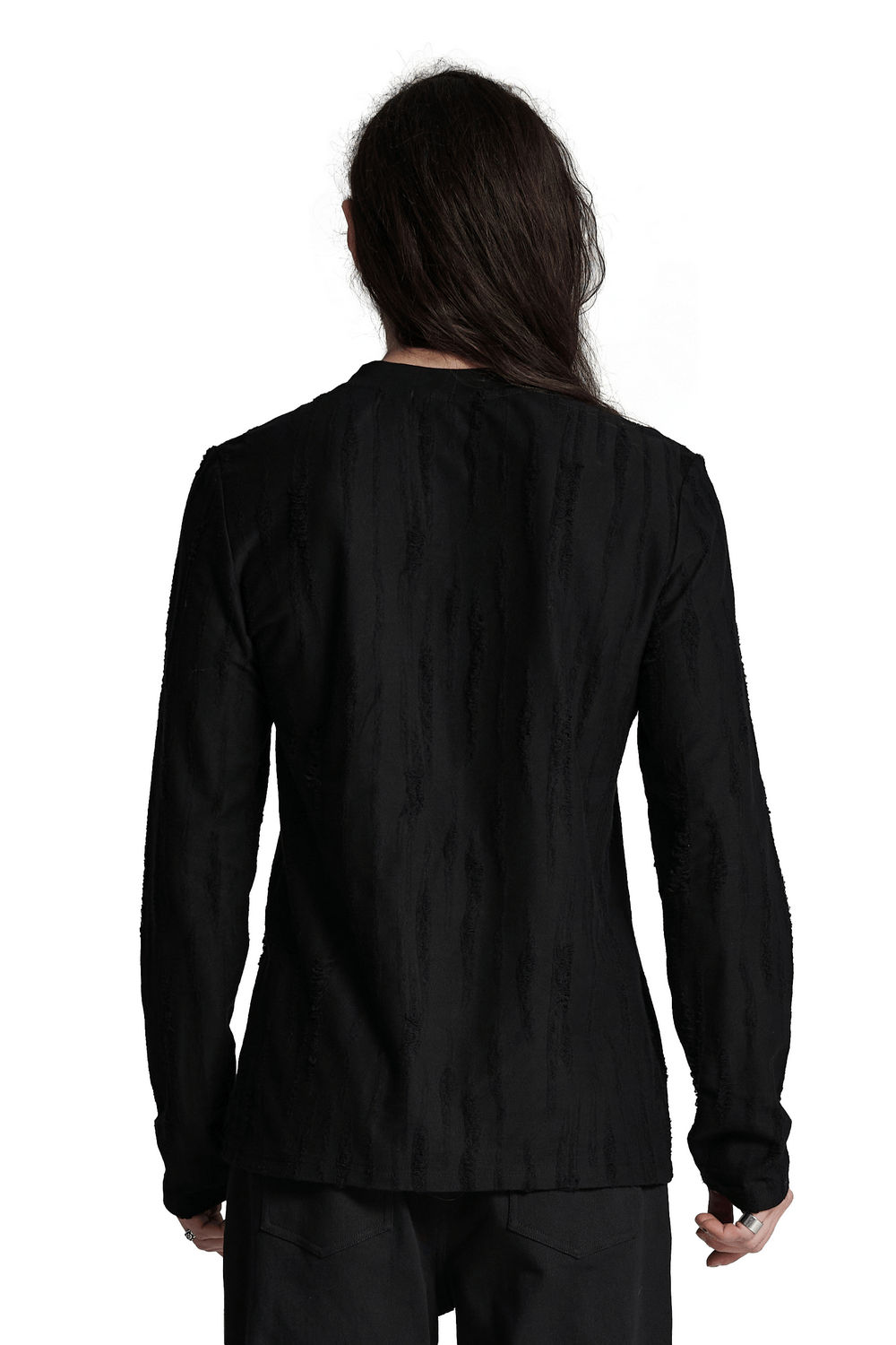 Back view of edgy black long sleeves punk top with distressed knit fabric.