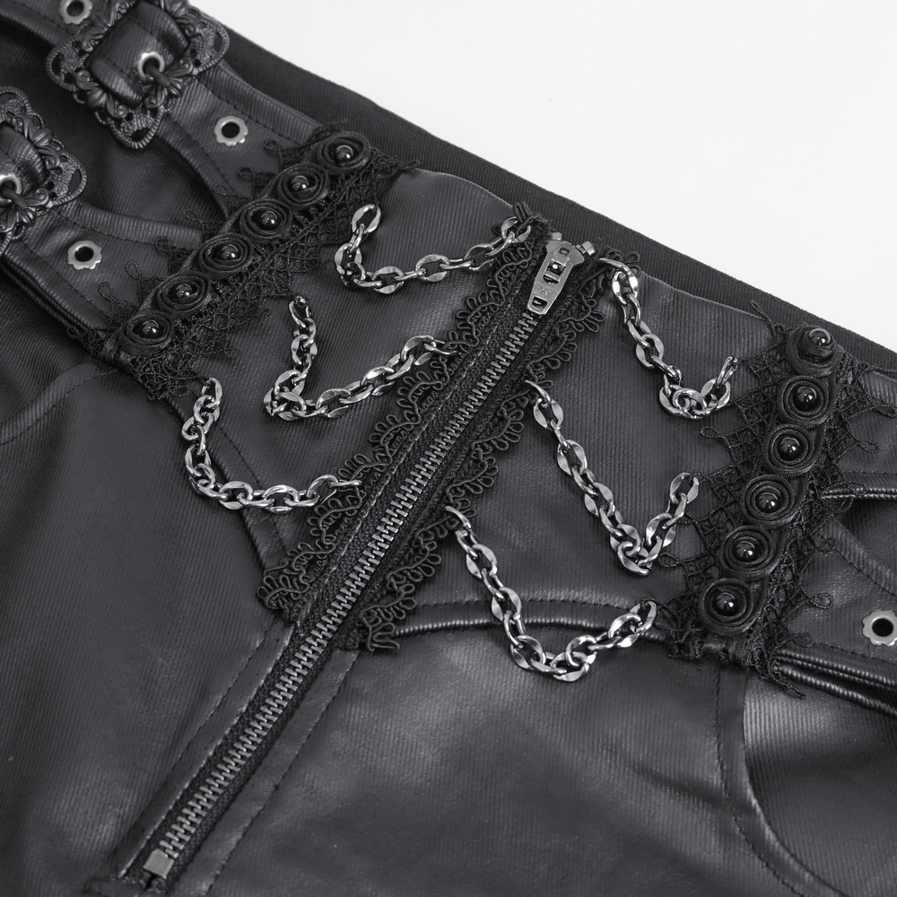 Close-up of edgy black male zippered pants with chains, buckles, and lace-up detailing for a bold look.