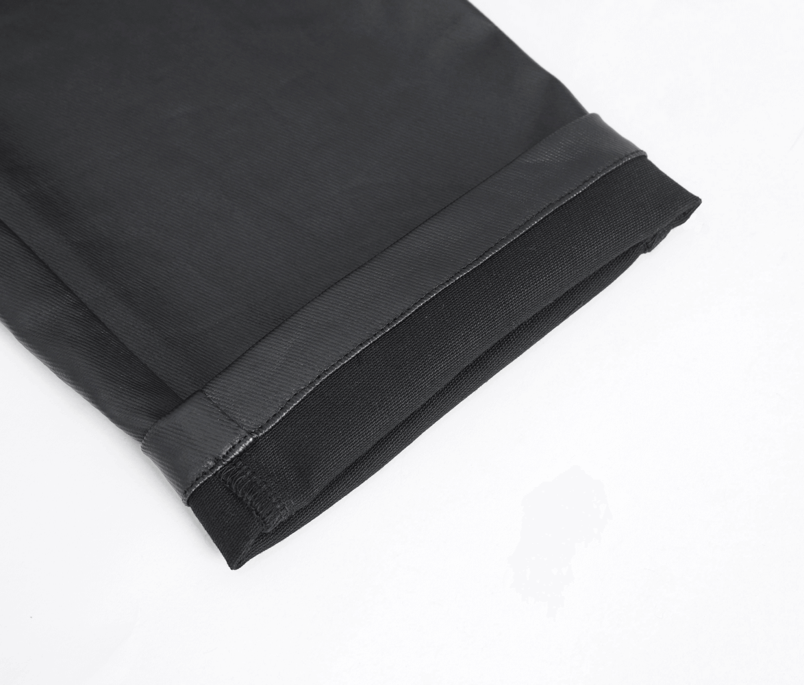 Close-up of the hem of edgy black male zippered pants with sleek finish, showcasing premium material and design details.