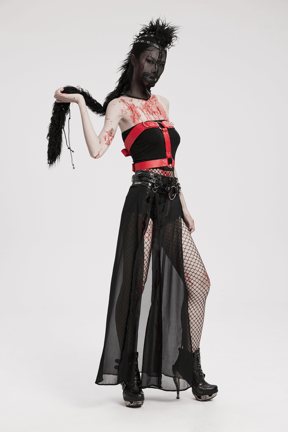 Edgy punk model showcasing black mesh hood, faux mohawk ponytail, and stylish outfit with blood splatter details.
