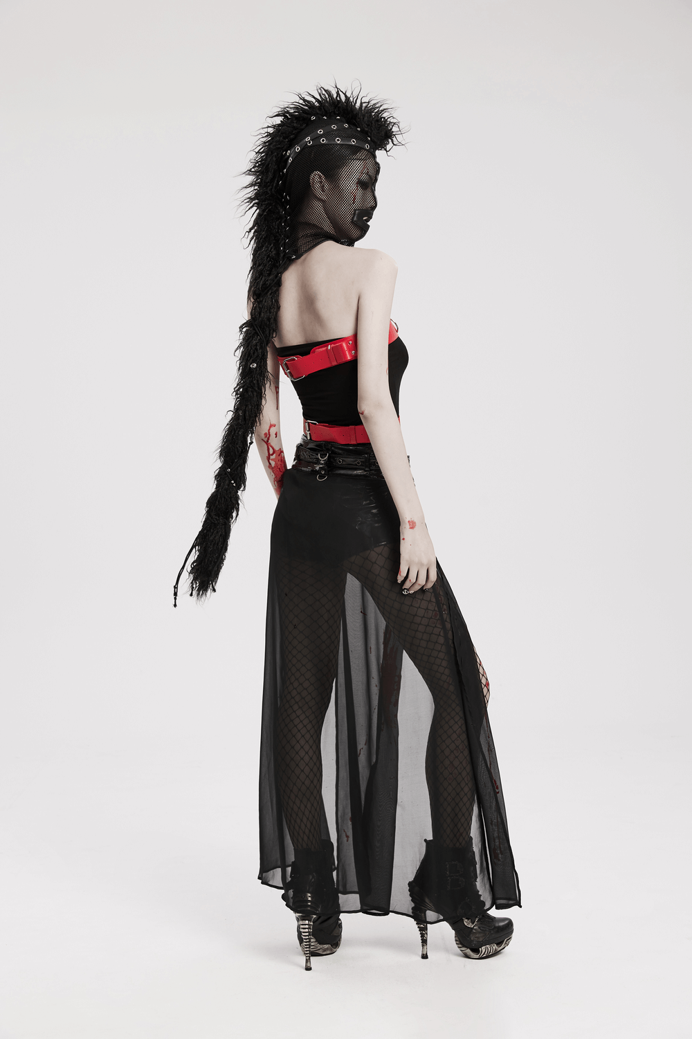 Model showcasing an edgy black mesh hood with mohawk ponytail, emphasizing punk style and bold fashion.