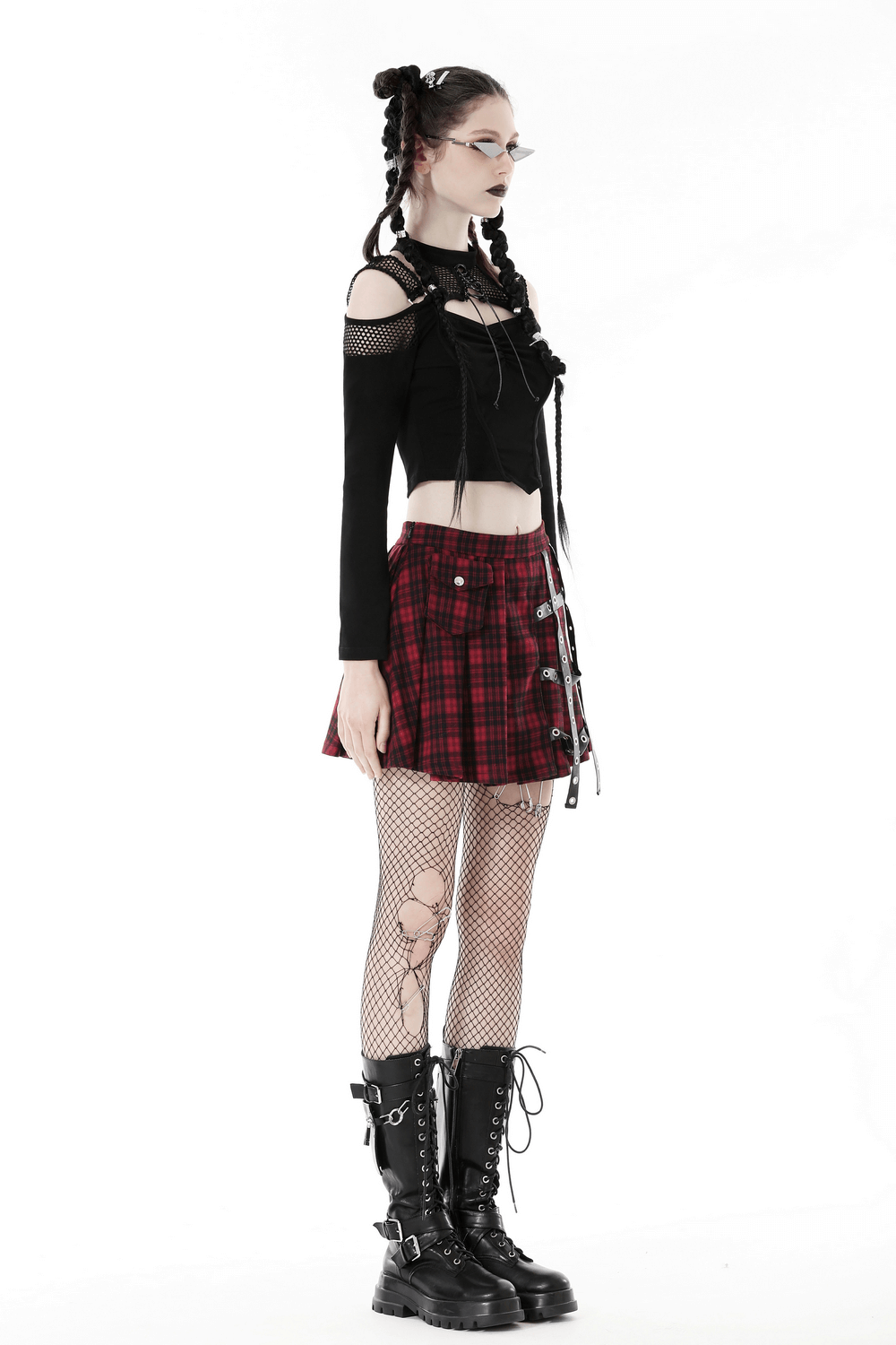 Edgy black off-shoulder mesh top paired with a red plaid skirt and fishnet tights for a punk-inspired look.