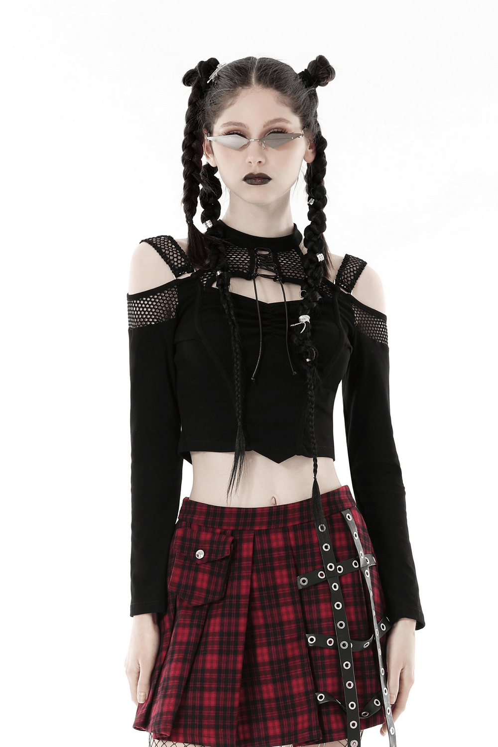 Edgy black mesh off-shoulder top with long sleeves, paired with a plaid skirt for a punk look.