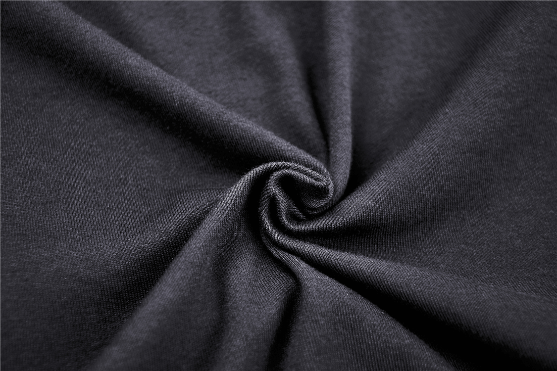 Close-up of soft black fabric, showcasing texture ideal for edgy fashion pieces like crop tops.