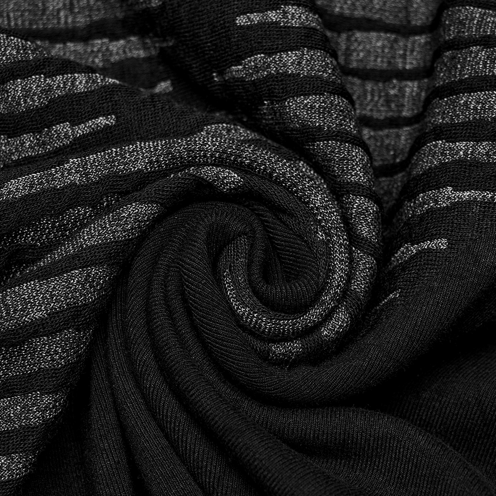 Close-up of black fabric with edgy spliced 3D jacquard pattern, showcasing its unique texture and rebellious style.