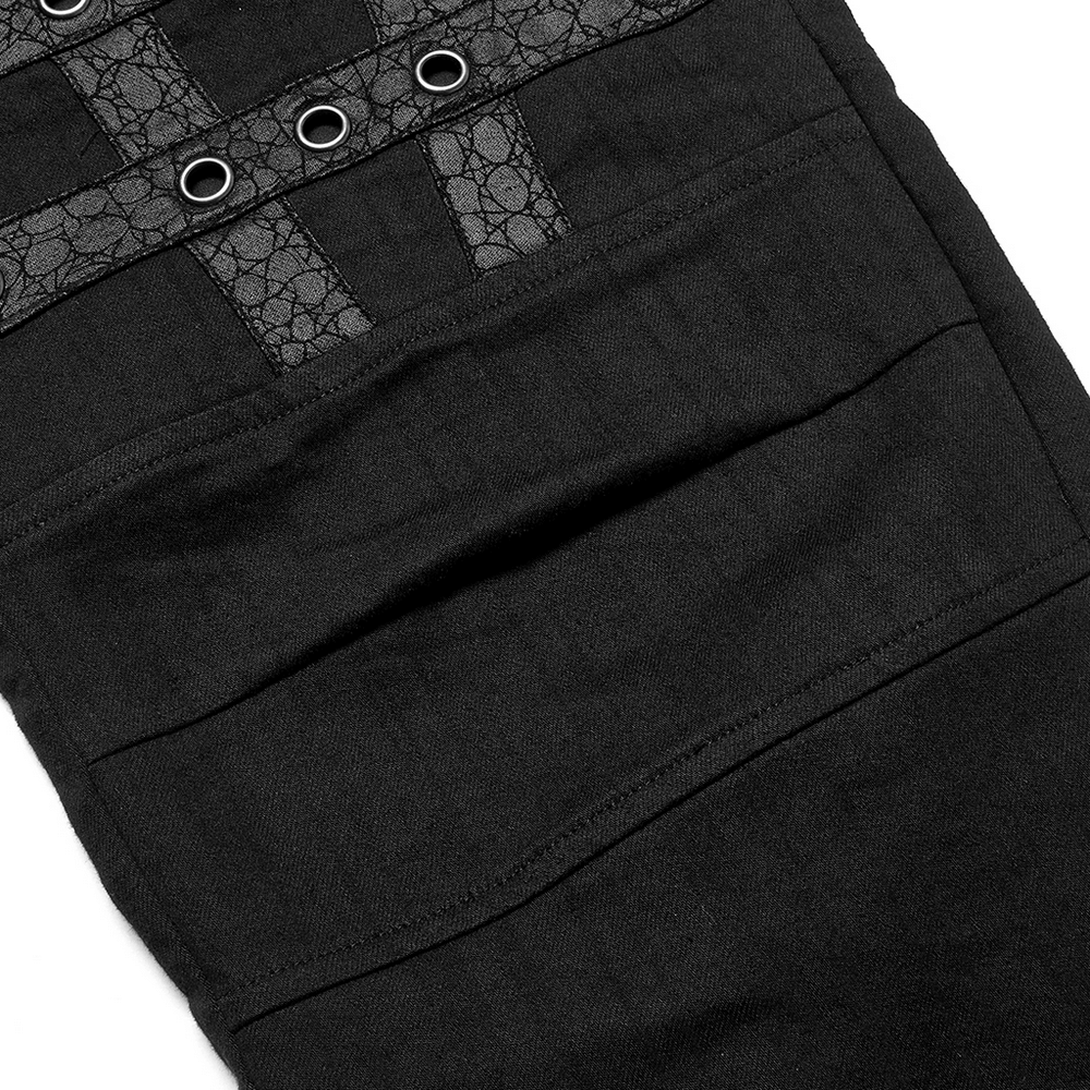 Close-up of edgy black cargo pants featuring decorative grommets and textured fabric, perfect for punk goth streetwear.