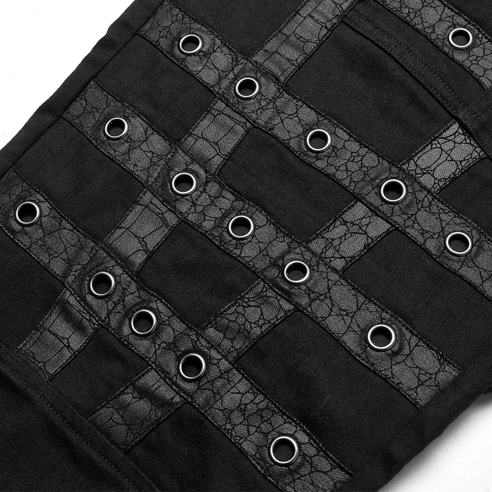 Close-up of edgy black cargo pants featuring decorative grommets and woven details, perfect for punk goth streetwear.