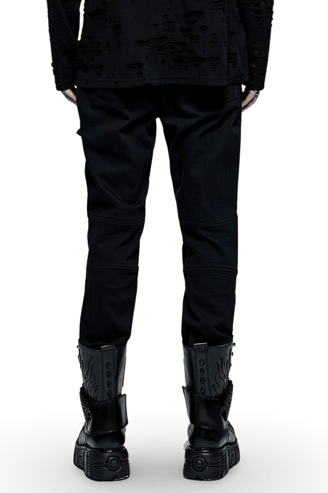 Edgy black strap cargo pants viewed from the back, paired with stylish chunky boots for punk goth streetwear vibe.