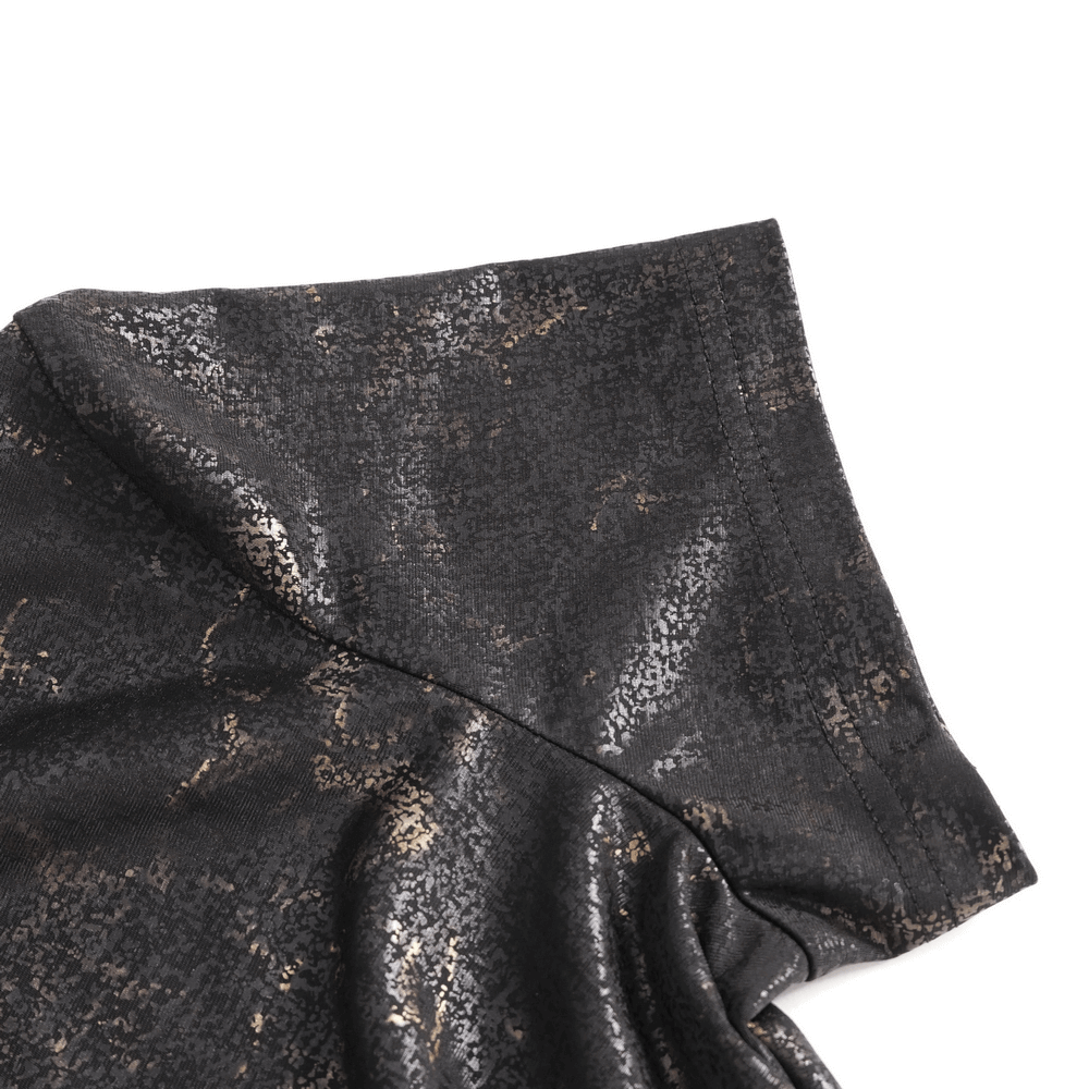 Close-up of edgy black t-shirt with gold metallic print on shoulder, showcasing soft cotton fabric.