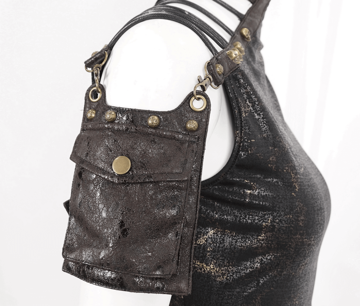 Edgy black t-shirt with metallic pocket detail on shoulder, perfect for a bold fashion statement.