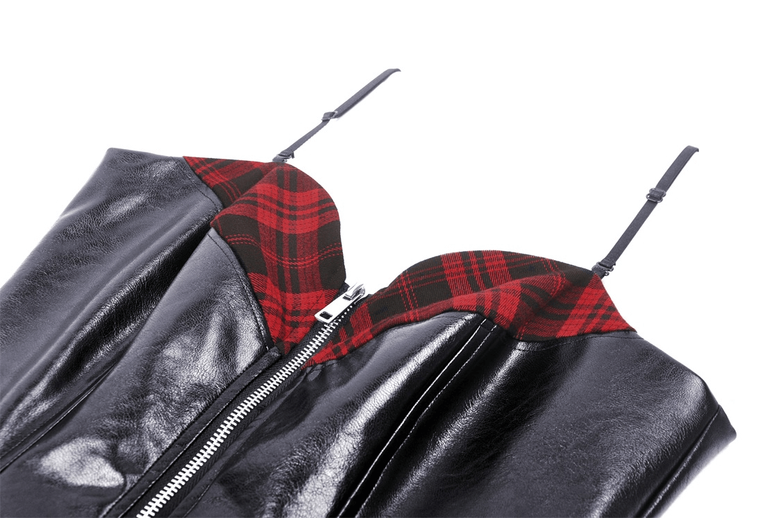 Close-up of edgy faux leather mini dress featuring plaid lining and zip-up front for bold fashion statements.