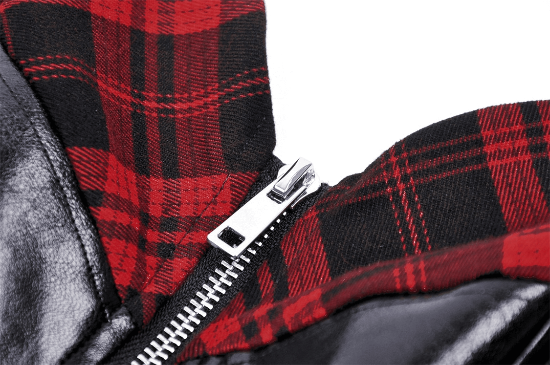 Close-up of zip-up faux leather mini dress showcasing red plaid lining and sleek black exterior.