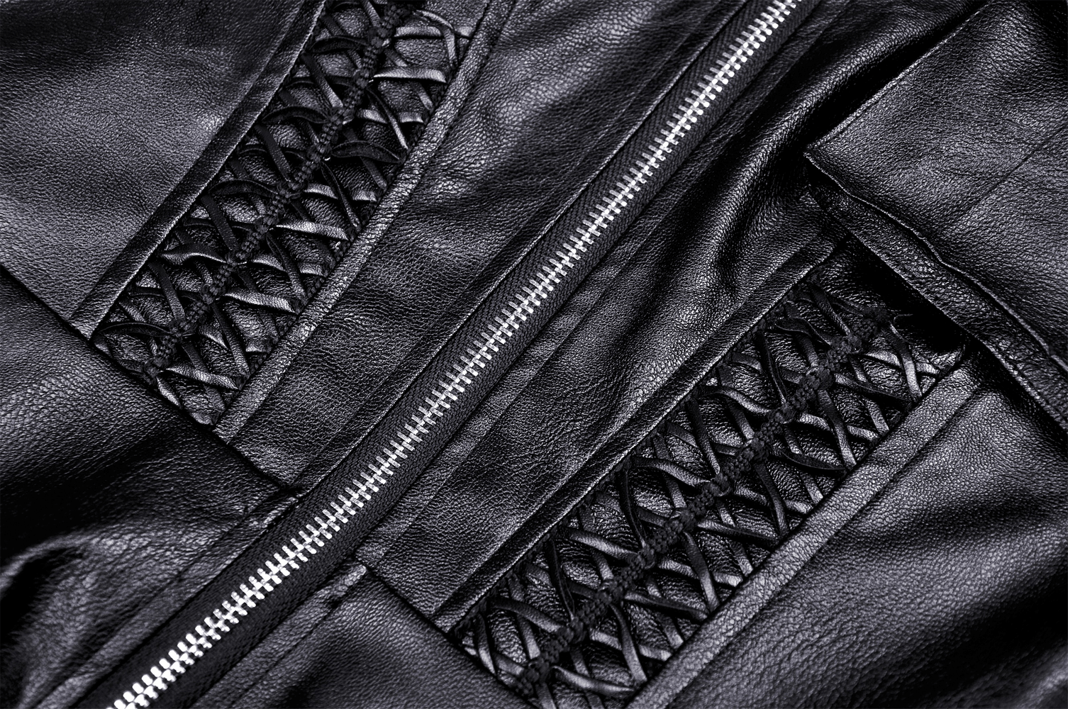 Close-up of edgy black faux leather with intricate lacing and metal zipper accents, perfect for a gothic-inspired outfit.