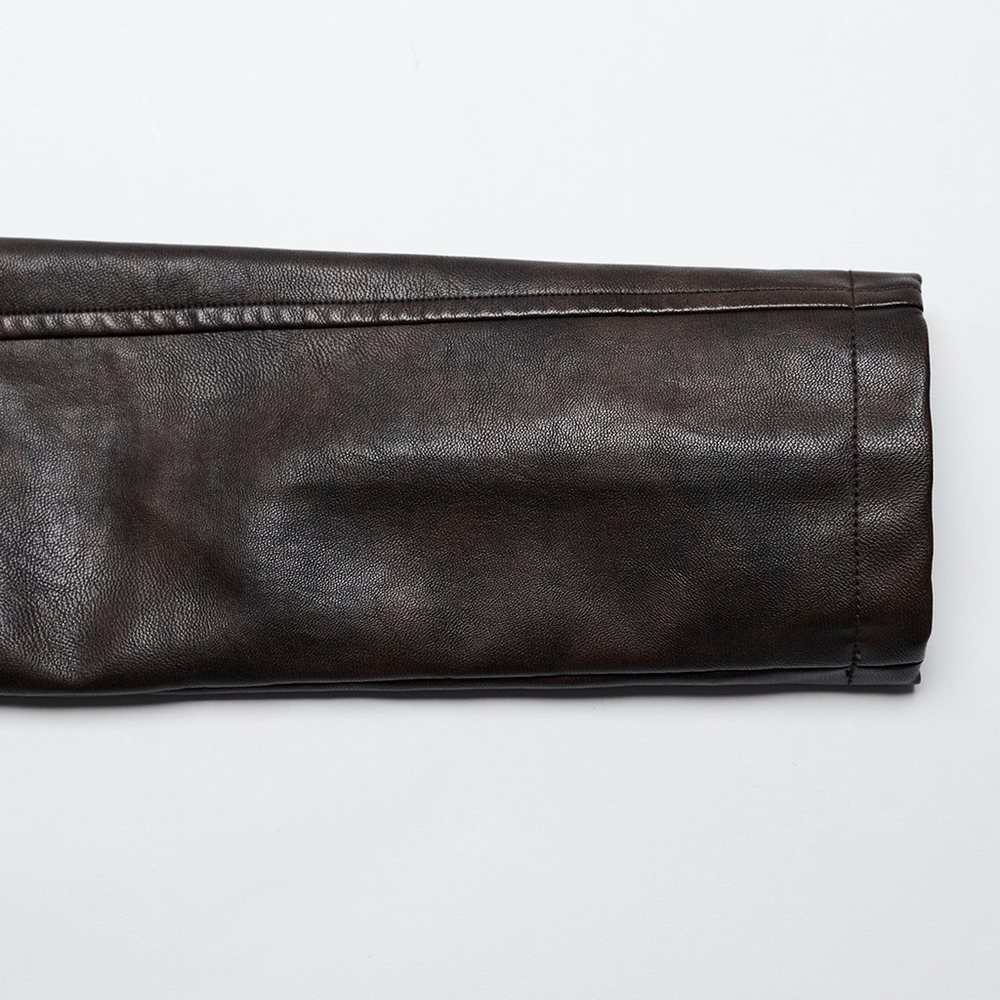 Close-up of a dark faux leather sleeve showcasing the texture of a punk crop jacket with edgy design.