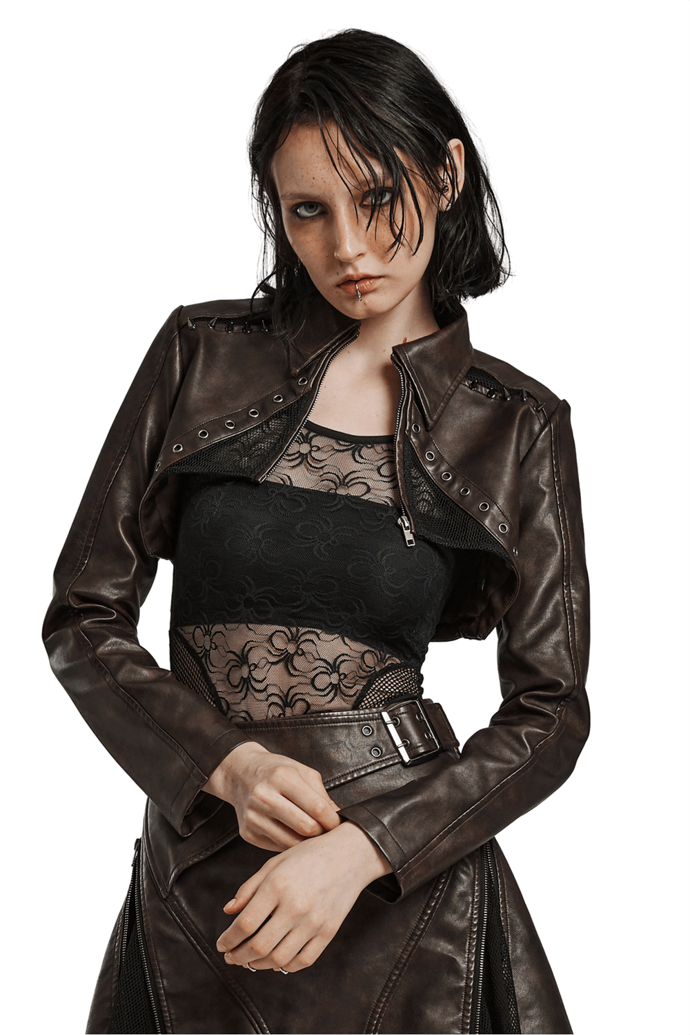 Edgy faux leather punk crop jacket with spikes, featuring mesh cutouts and a bold aesthetic.