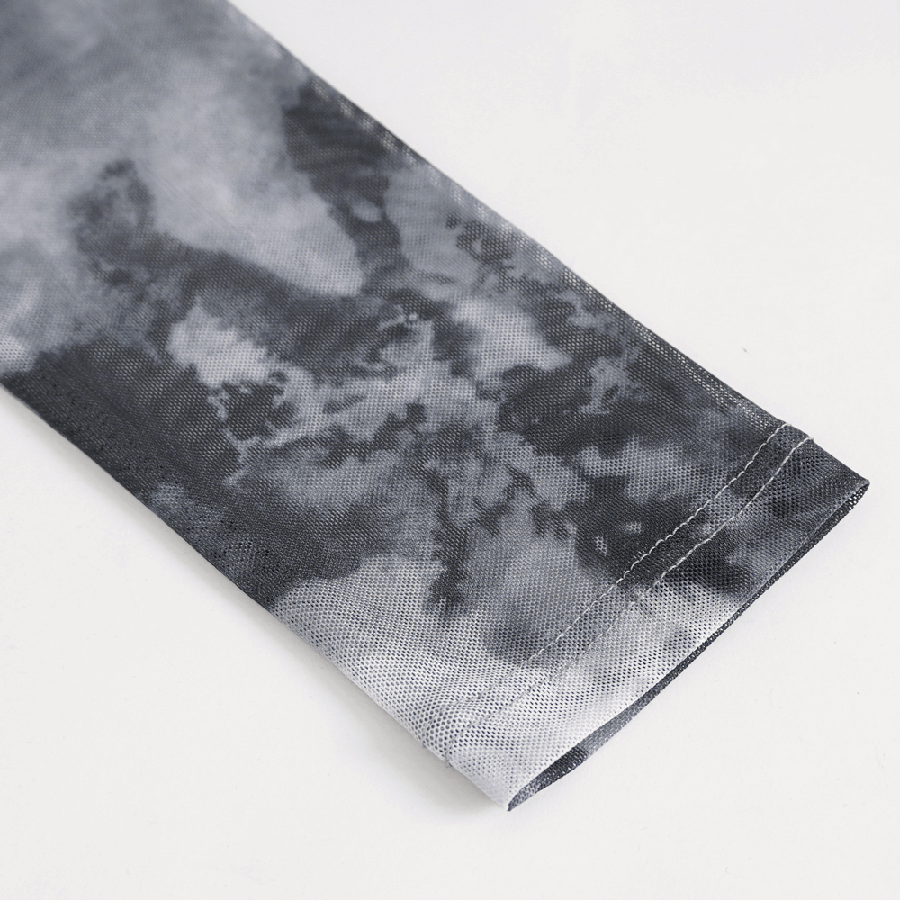 Close-up of the sleeve featuring a modern grey and white tie-dye pattern on a stylish female top.