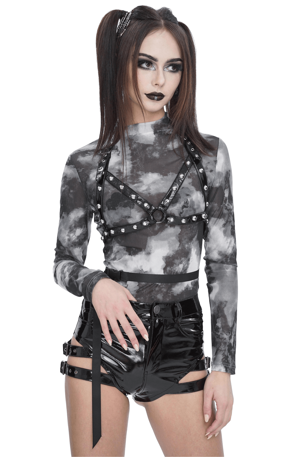 Edgy grey and white tie-dye long sleeve top with studded harness detail, paired with shiny black shorts.