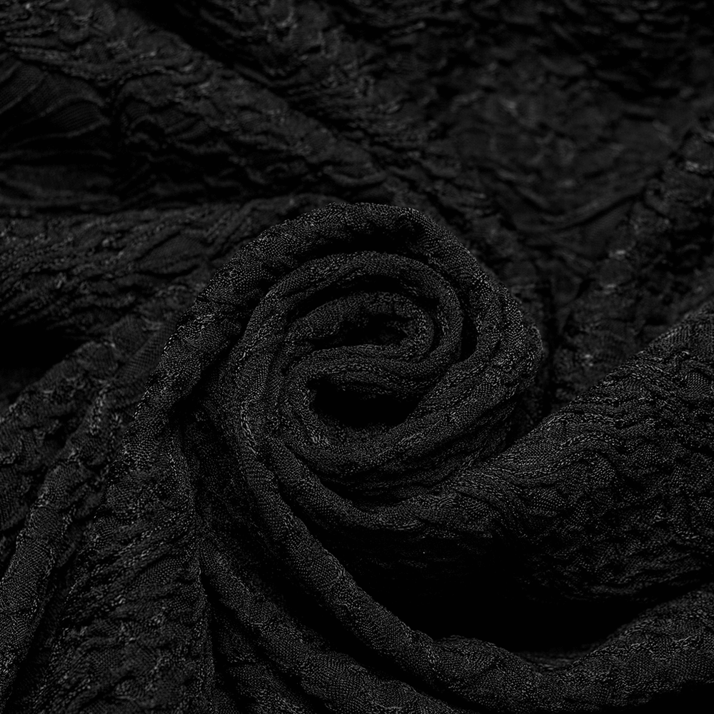 Close-up of luxurious black 3D jacquard fabric, showcasing intricate texture and elegant design details.