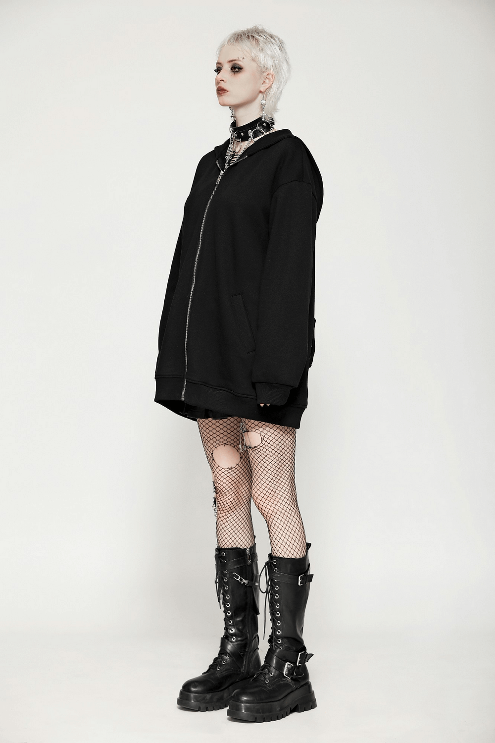 Edgy gothic batwing zip-up hoodie on a model with fishnet stockings and chunky boots, showcasing a unique oversized style.