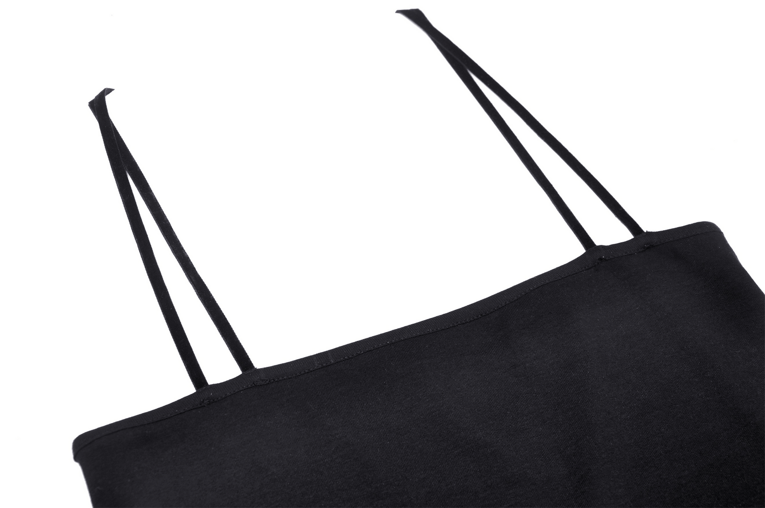 Close-up of strappy black crop top highlighting sleek straps and fabric texture for edgy style.