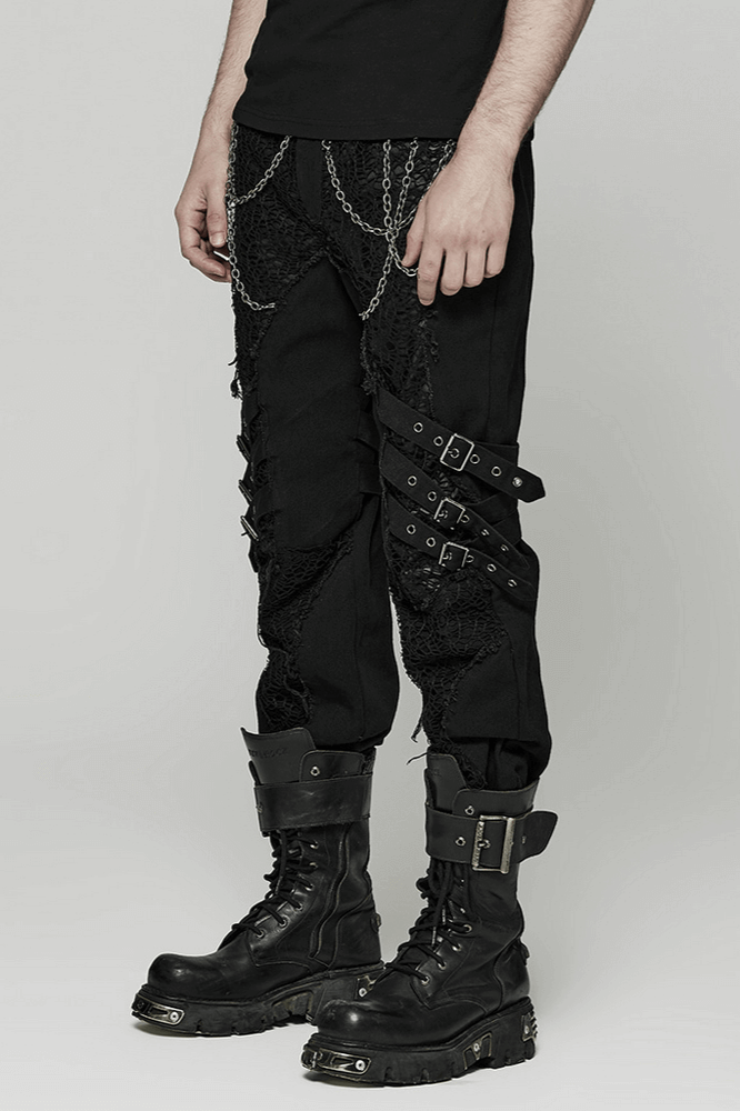 Edgy gothic black trousers with chains and buckles, showcasing punk-inspired avant-garde style.
