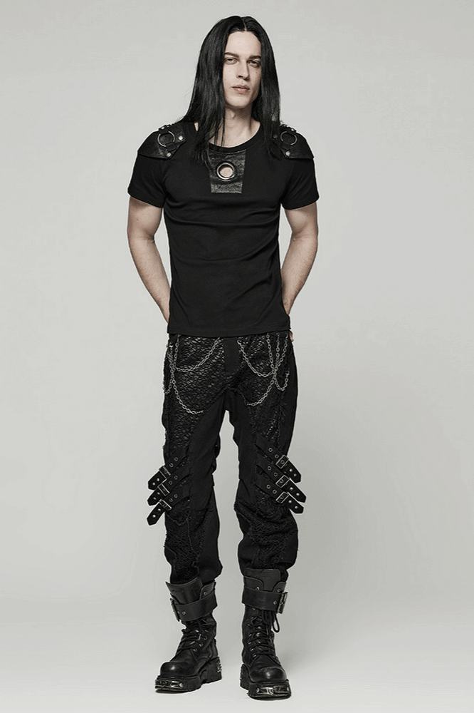 Edgy gothic black trousers with chains and buckles, showcasing punk-inspired avant-garde fashion.