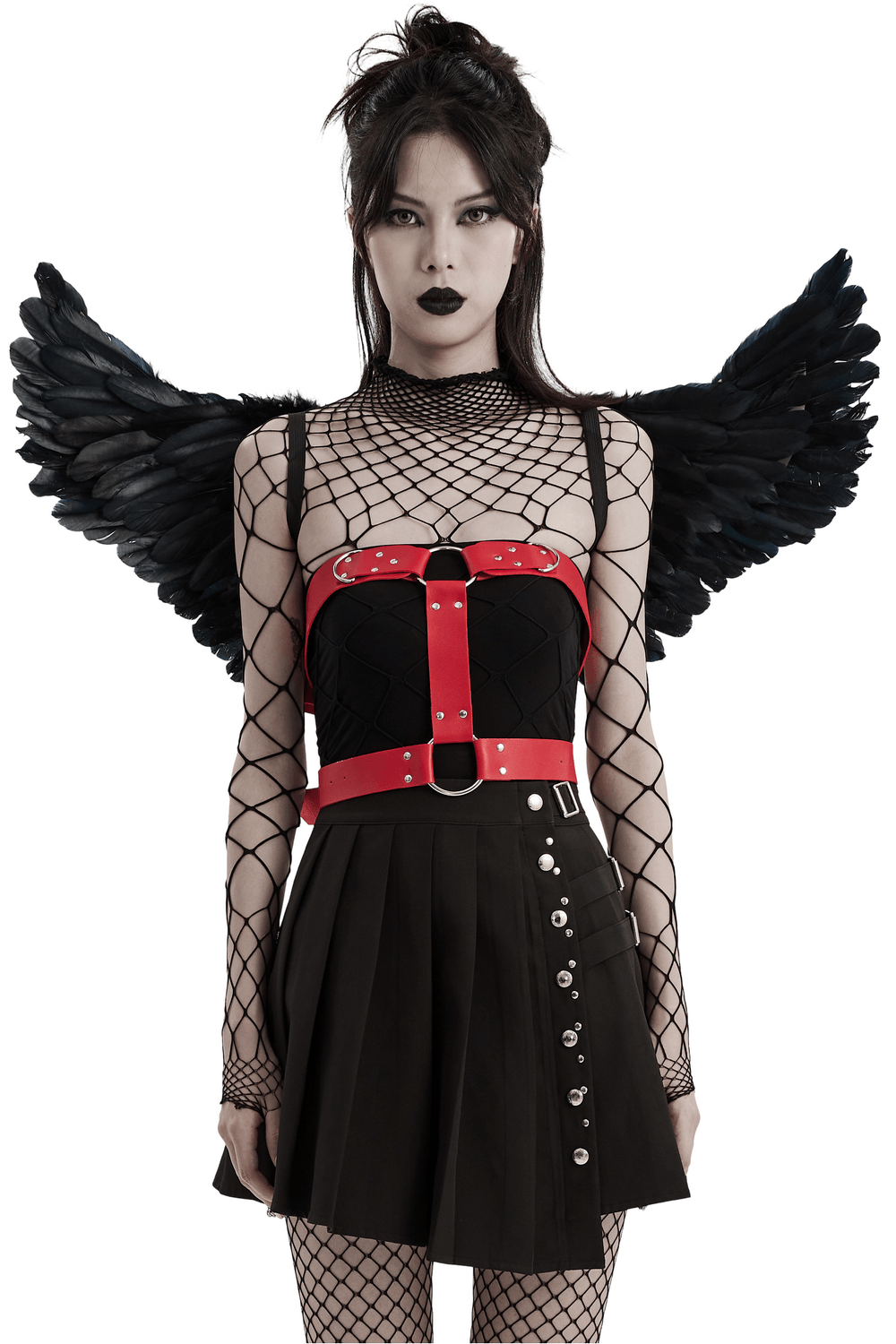 Edgy gothic model wearing black raven feather wing harness with chains and red accents, showcasing dark fashion.