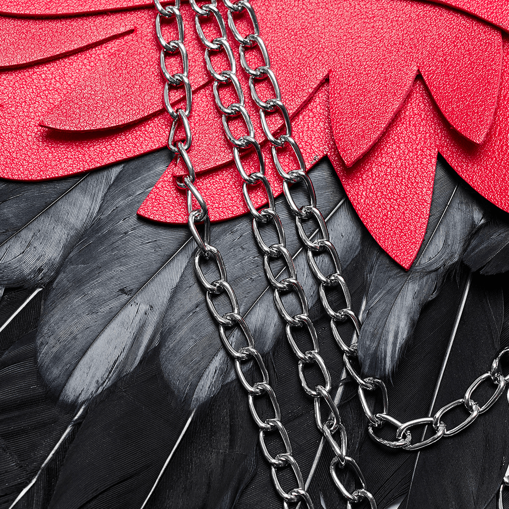 Close-up of black feather wings with vibrant red accents and chains, showcasing a gothic, edgy style.
