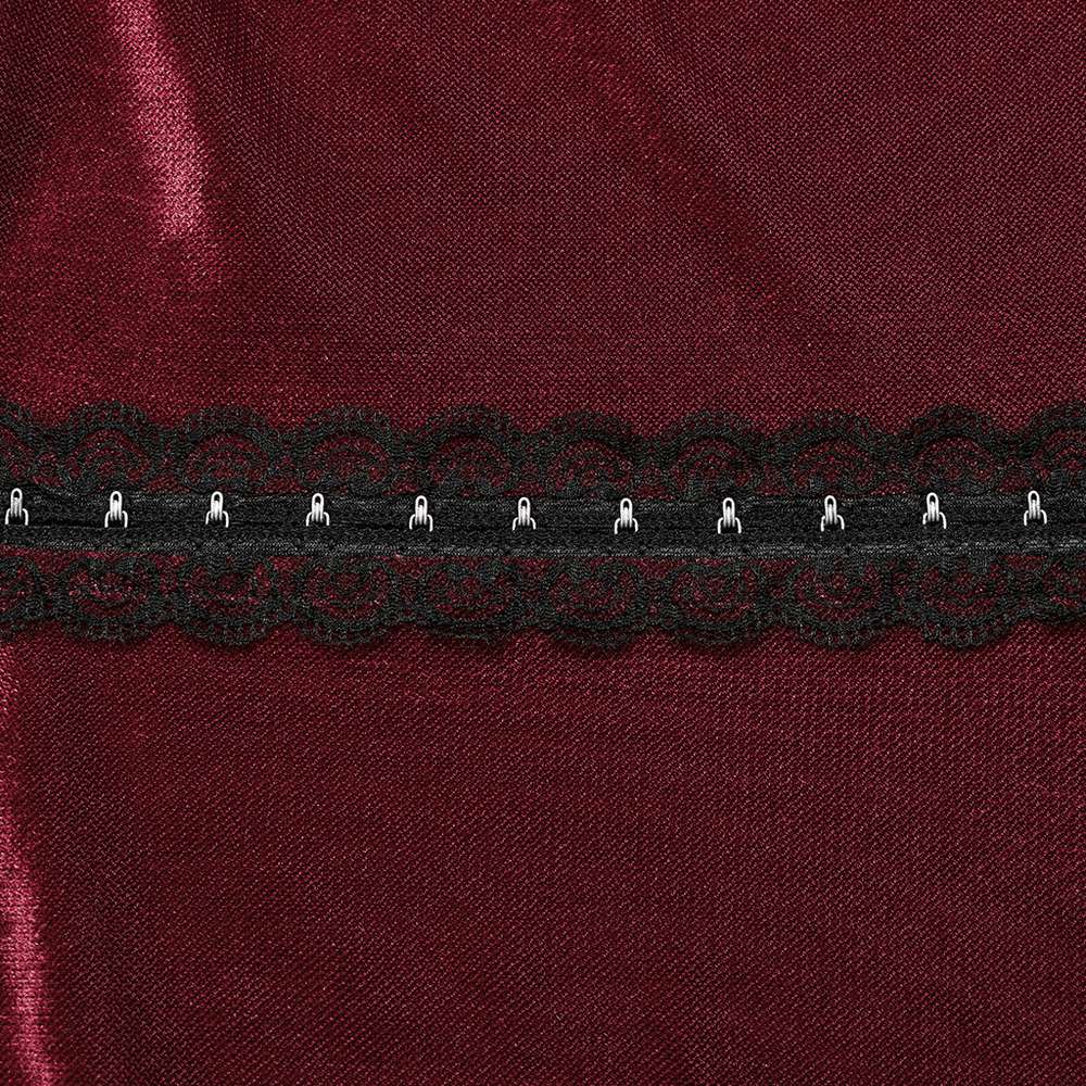 Close-up of intricate black lace hooks on burgundy gothic top, showcasing edgy mesh texture and stylish design.
