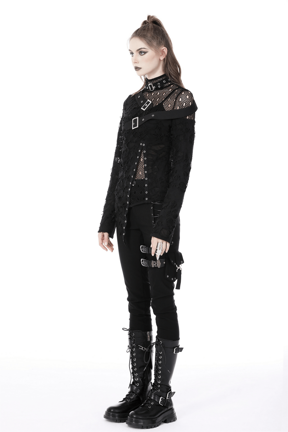 Edgy grunge mesh sweatshirt with buckle accents, styled with black pants and combat boots, embodying punk fashion.