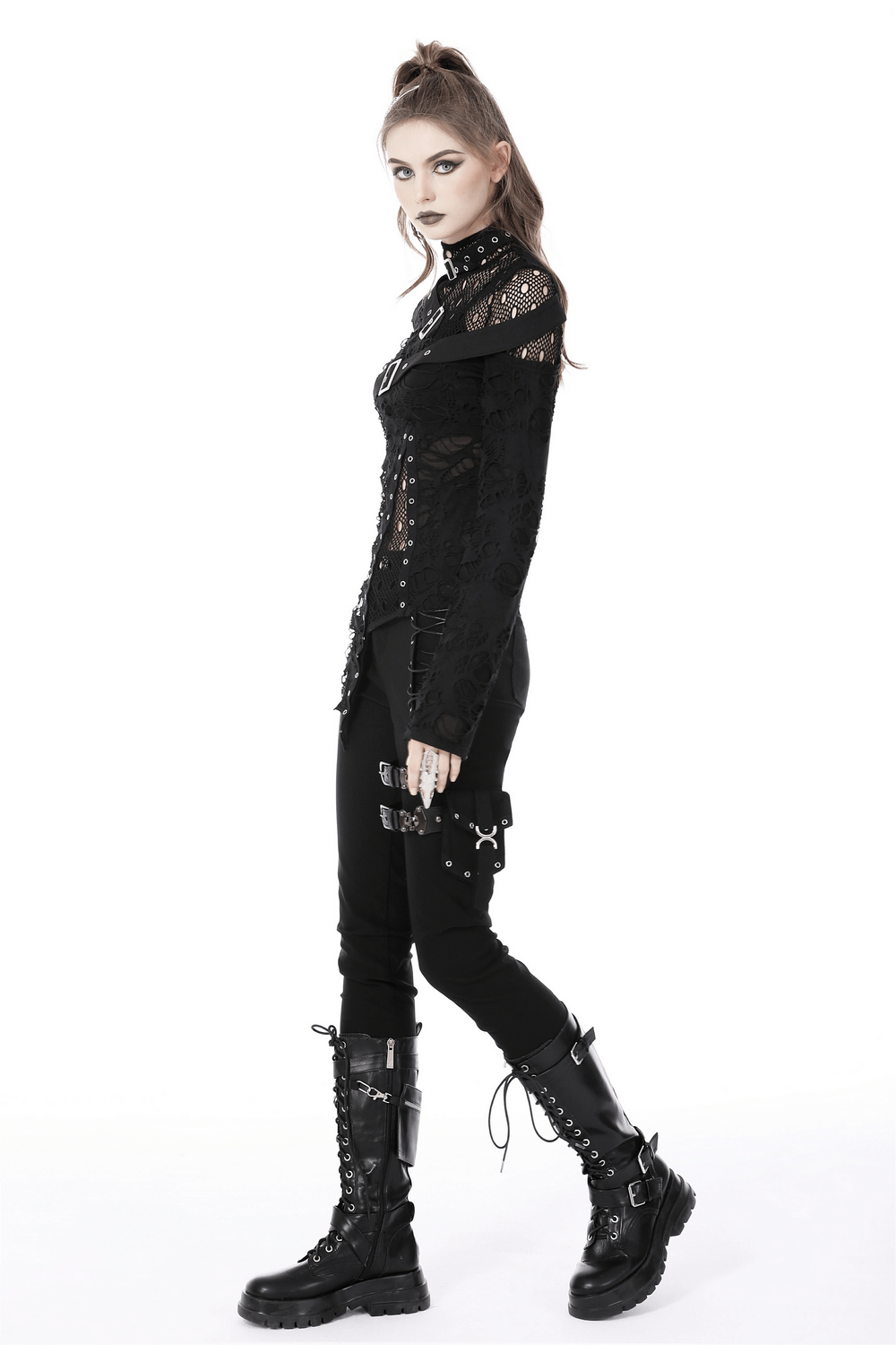 Edgy grunge model in a deconstructed mesh sweatshirt with buckle accents, styled for punk rock aesthetics.