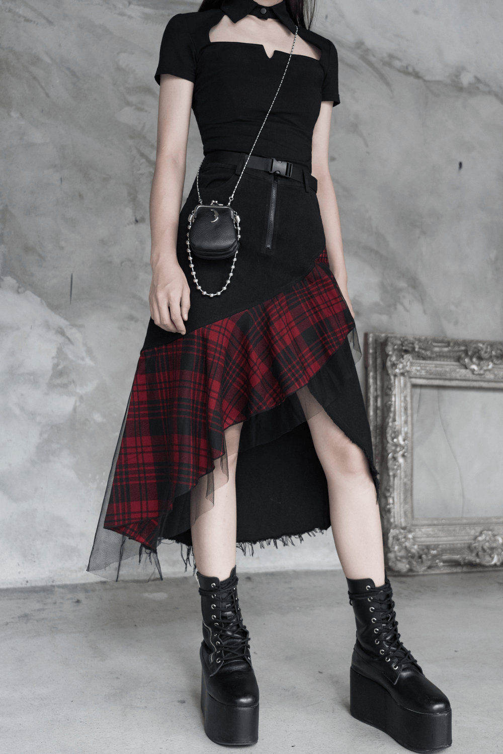 Edgy high-waist plaid skirt with irregular hem, paired with trendy platform boots for a bold punk look.