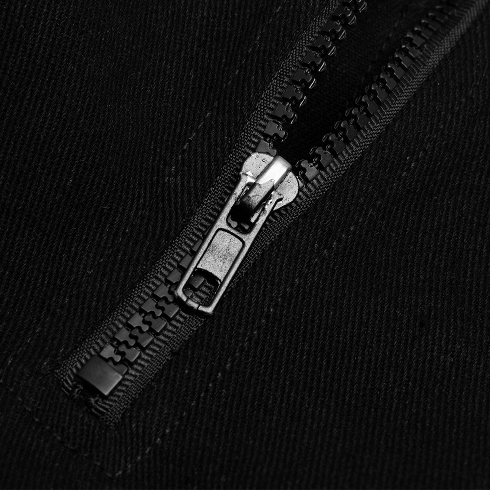Close-up of a sturdy black zipper on fabric, showcasing quality craftsmanship and durability.